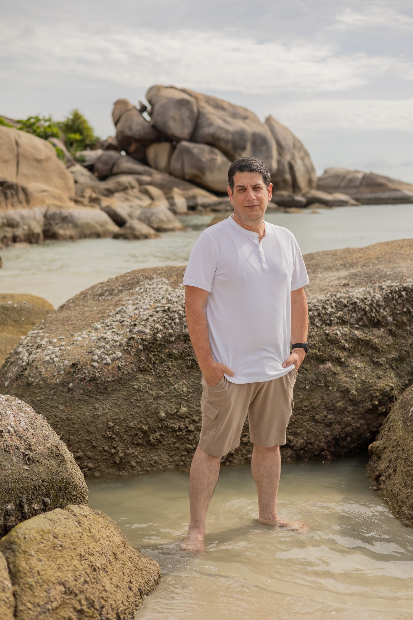 Shay Eisenberg standing by the shore